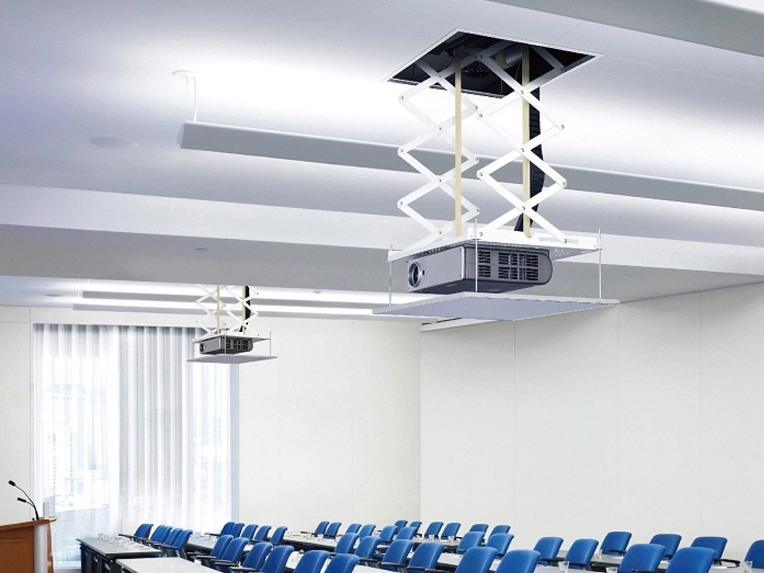 Projectors with electric fittings coming out of the ceiling, demonstrating a professional install by approved AV experts