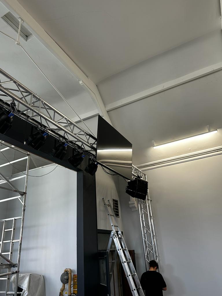 pa system with tv on trussing as part of a church audio visual installation