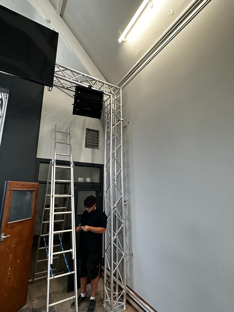 speaker and TV erected onto trussing as part of a church audio visual installation